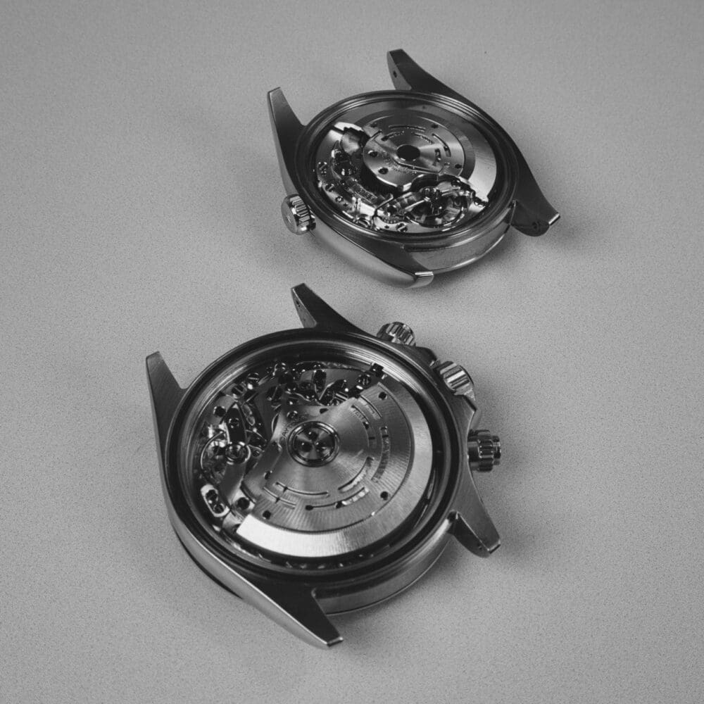 DSC00694 - Watches Of Henley St Two stainless steel watch cases stripped for servicing on the bench in our Birmingham atelier