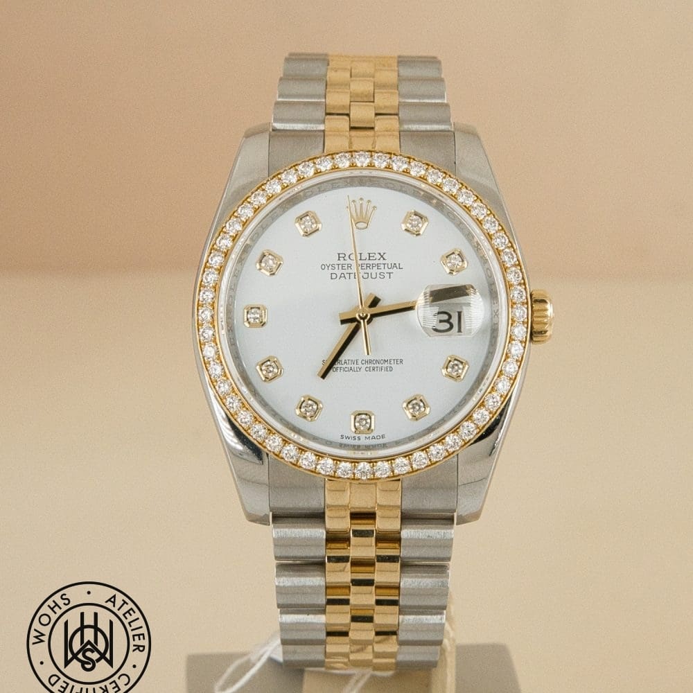 Two-tone Rolex Datejust with diamond bezel and diamond hour markers on white dial, date window at 3 o'clock.