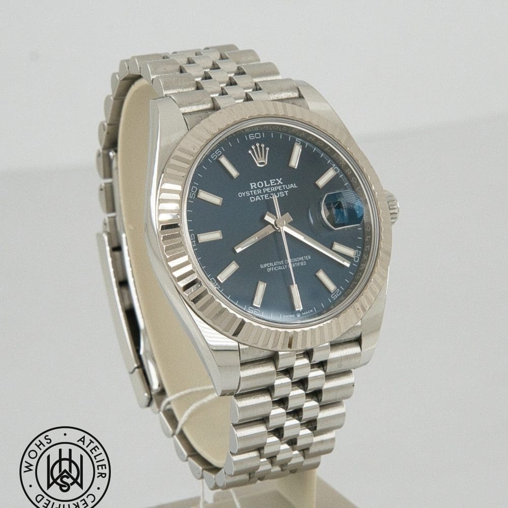 Rolex Oyster Perpetual Datejust stainless steel watch with a blue dial and fluted bezel on display. DSC03102
