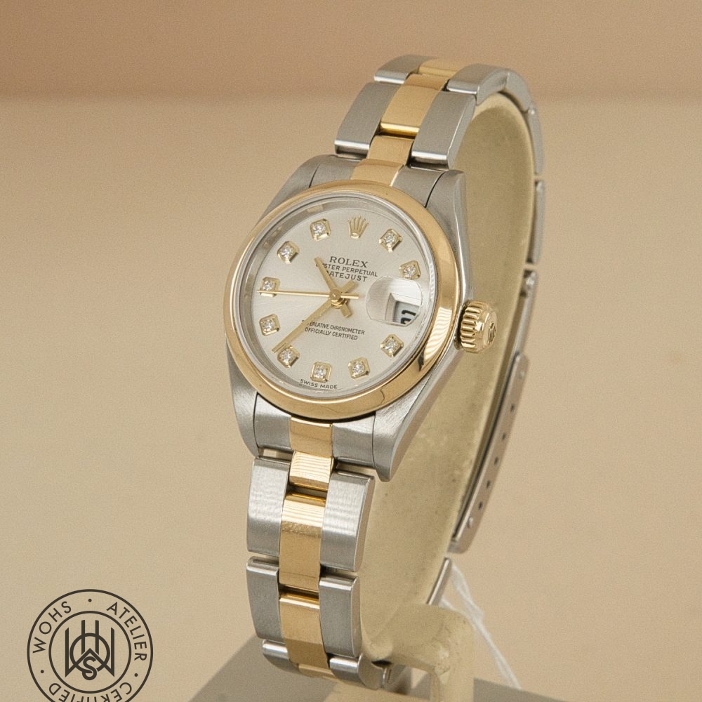 Two-tone Rolex Datejust wristwatch with diamond hour markers and date magnifier on a display stand Preowned Rolex Lady Datejust 79163 silver diamond 1