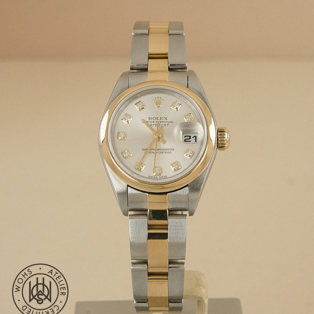 Two-tone Rolex Datejust wristwatch with diamond hour markers and a gold bezel, showing date at 3 o'clock.] Preowned Rolex Lady Datejust 79163 silver diamond 2
