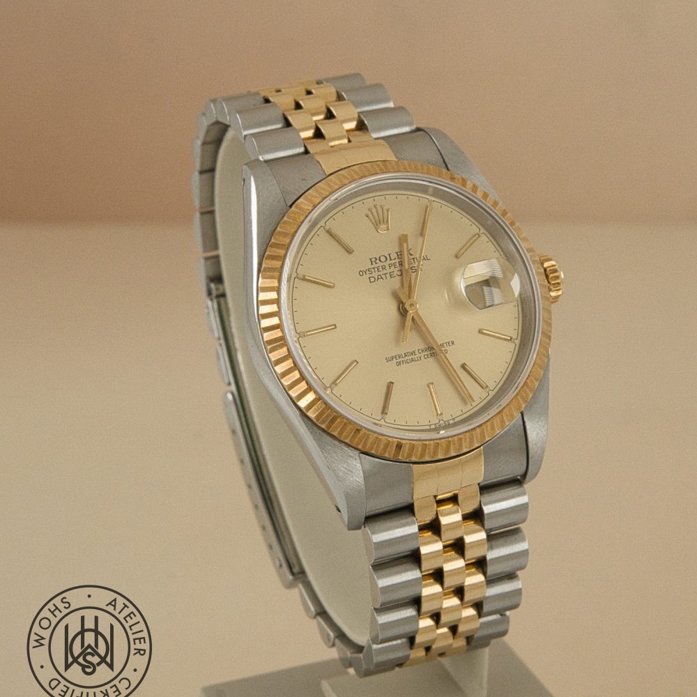 Two-tone Rolex Datejust wristwatch with a gold fluted bezel and champagne dial on a two-tone bracelet.] sounds wrong with bracket. Rolex Datejust 36mm reference 16233 3