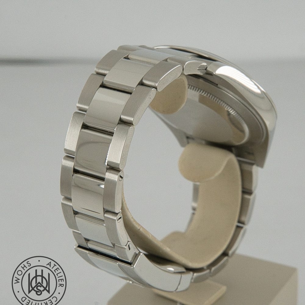 Close-up of a stainless steel watch bracelet on a display stand, showing brushed and polished links.]** Rolex Datejust 41 2026 reference 126300 box papers blue azzuro dial 4