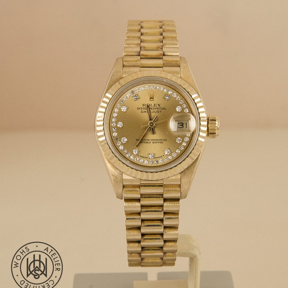 Gold Rolex Oyster Perpetual Datejust wristwatch with diamond-studded dial and bezel, displayed upright with a date window showing 31. Rolex Ladies Datejust 26mm 69178 Diamond Hour and Pave set markers 18ct dial 2