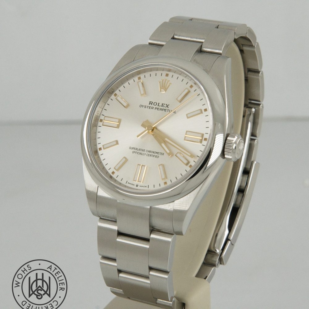 Rolex Oyster Perpetual stainless steel watch with a cream dial, gold markers and hands on a silver bracelet Rolex Oyster Perpetual Pre-Owned reference 134300 41mm silver dial box papers 2025 1