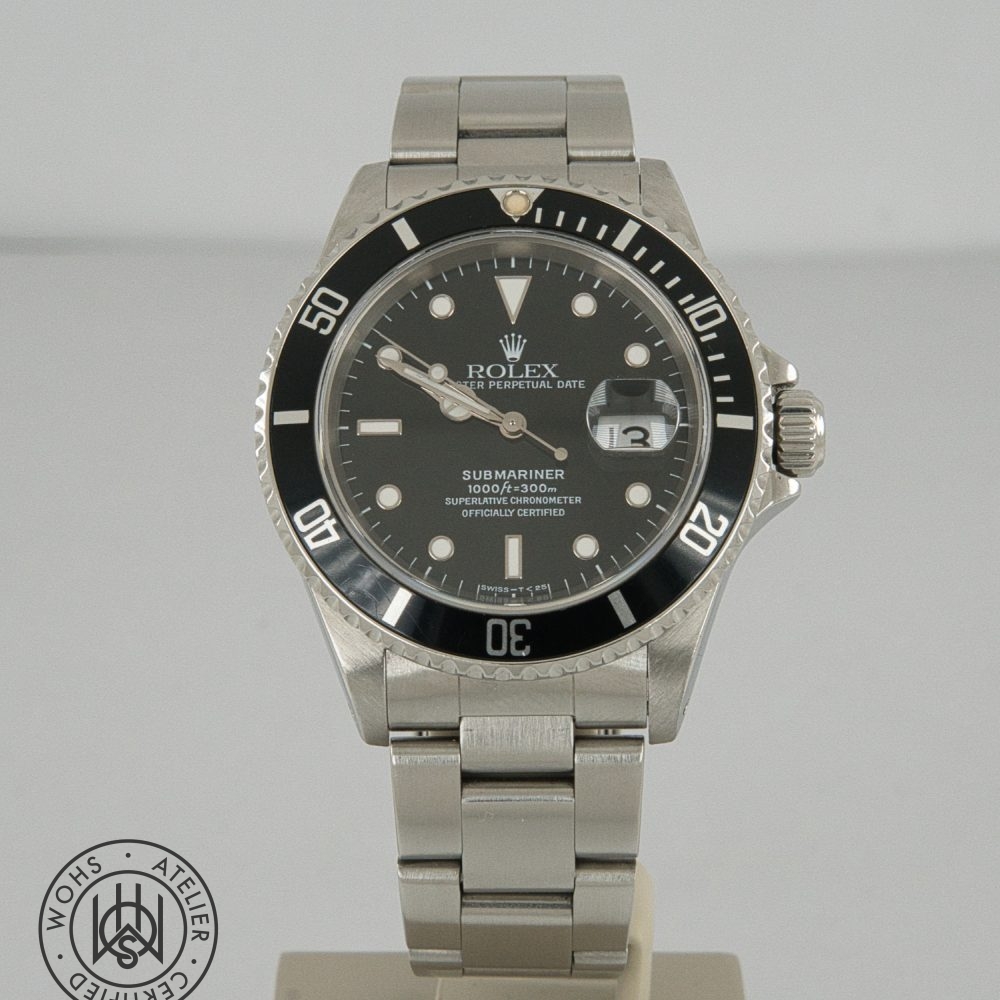 Rolex Submariner stainless steel watch with black dial, date window, and unidirectional bezel Rolex Submariner reference 16610 preowned 1998 box papers 2