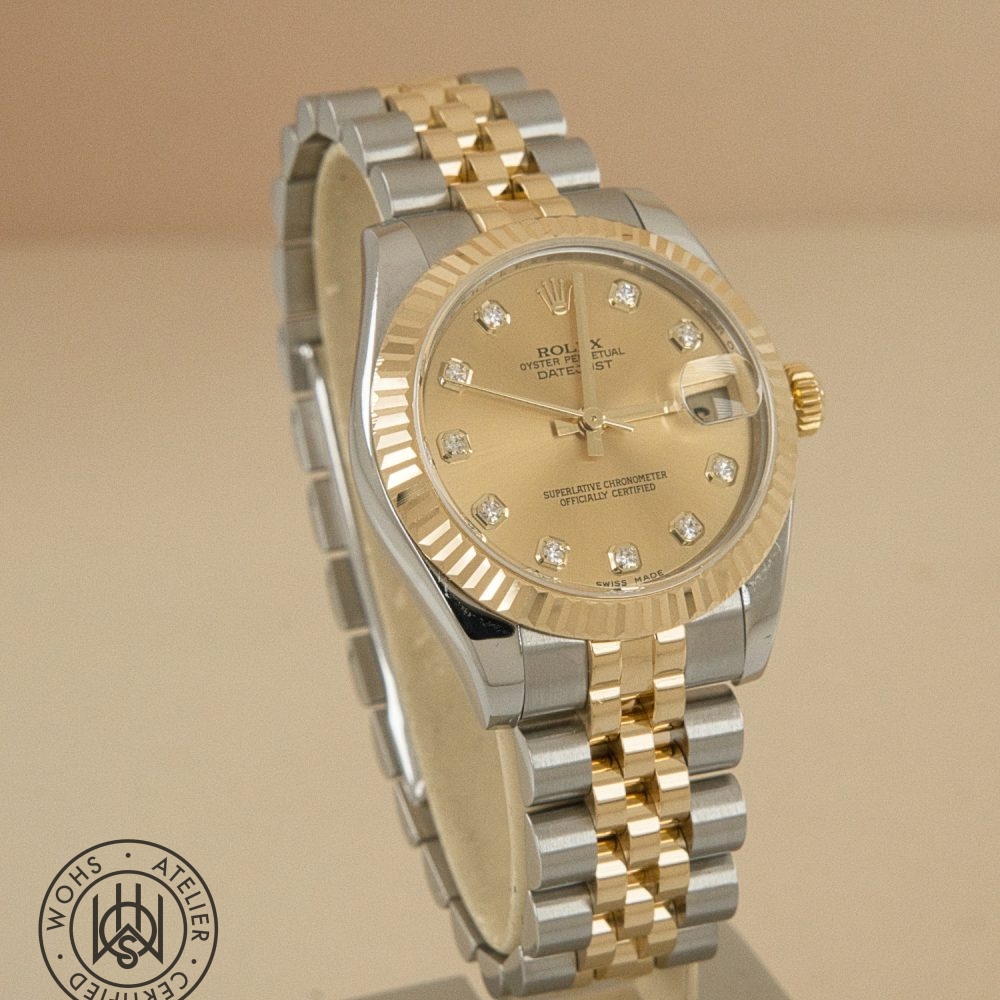 Two-tone Rolex Datejust wristwatch with gold bezel, gold and steel bracelet, and diamond hour markers. Used Ladies Rolex datejust reference 178273 champange diamond dial 3