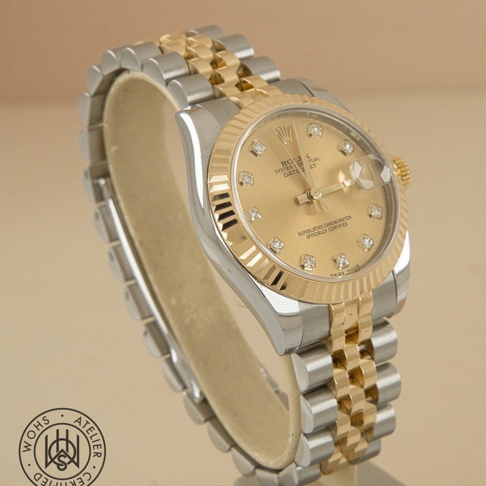 Two-tone Rolex Datejust wristwatch with gold bezel, diamond hour markers, and a two-tone bracelet on a beige background. Used Ladies Rolex datejust reference 178273 champange diamond dial 4